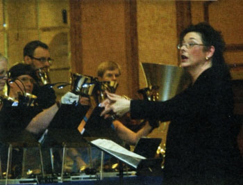 Deborah Carr, right, conducts the National All-Star Handbell Ensemble